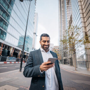 Salesman walking down street and texting with conversational sales